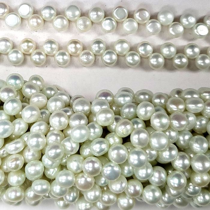 FRESHWATER PEARL DANCING BUTTON 6.5-7MM VERY LIGHT GREEN
